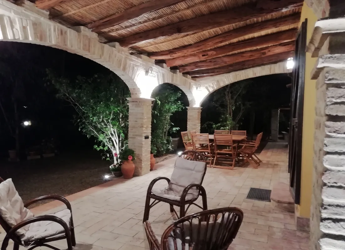 Inside the finished veranda, evening view with the dining table