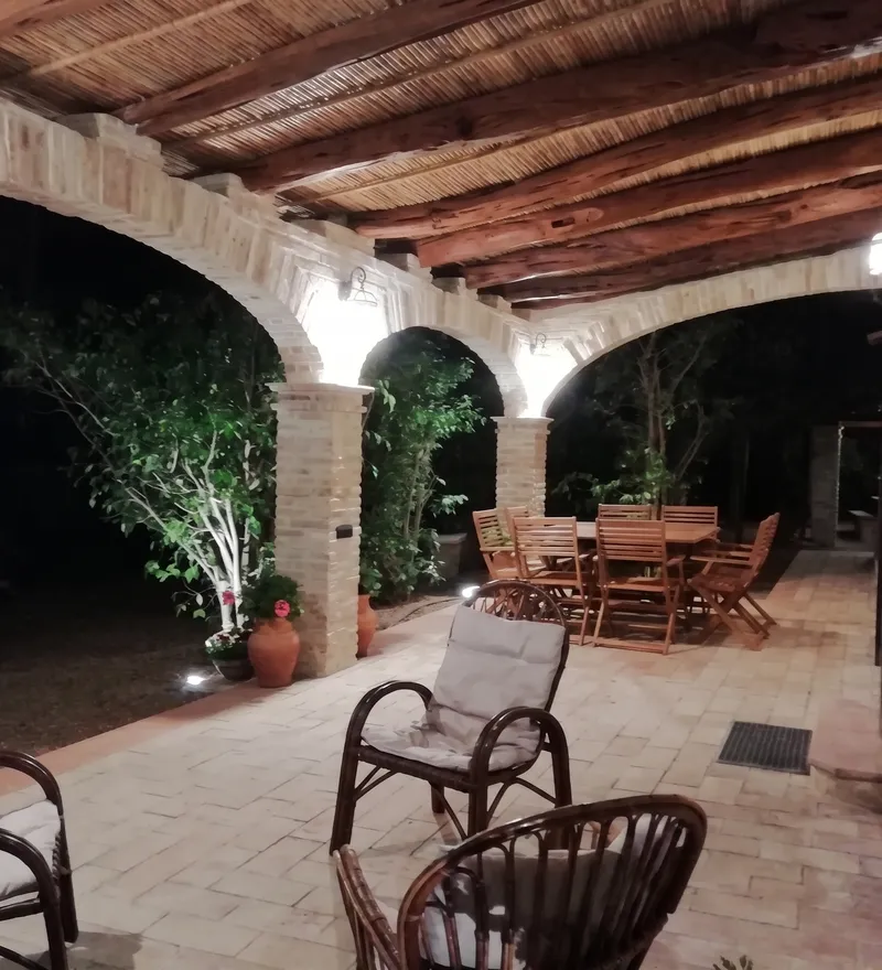Campidano-style veranda with brick structure, pillars and timber roof
