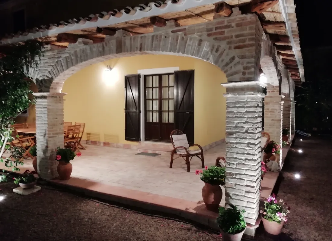 Front of the villa with the veranda, evening view